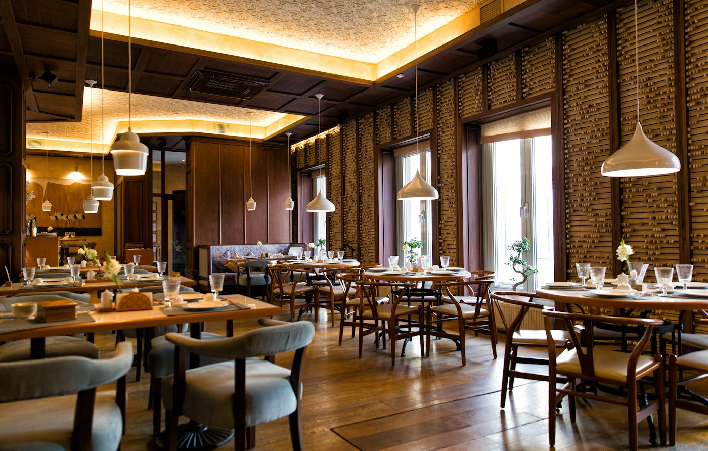 Warm wood restaurant interior with window light